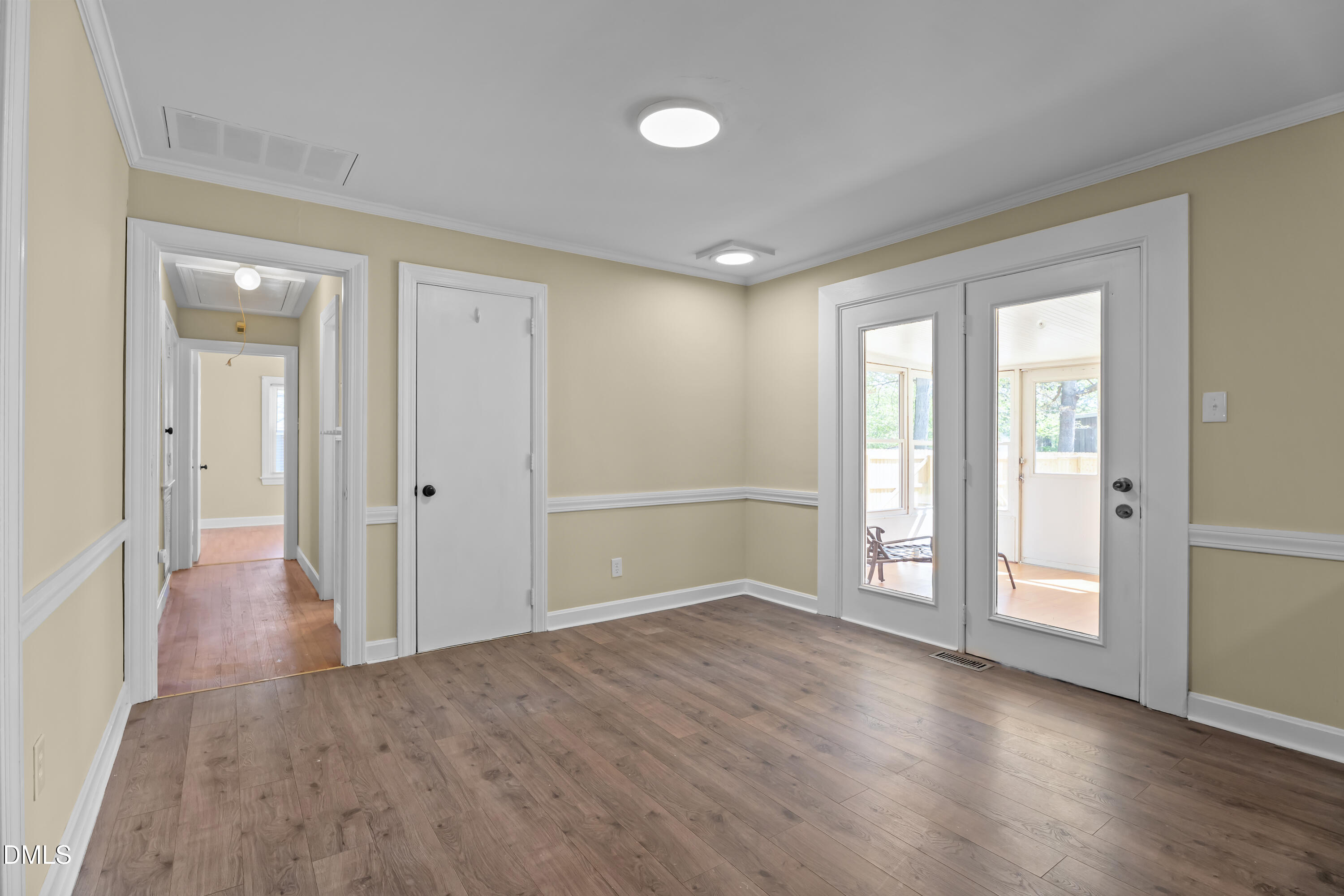 4149 Woodcrest Road Rocky Mount, NC 27803 - Photo 17 of 43 an empty room with wooden floor and windows