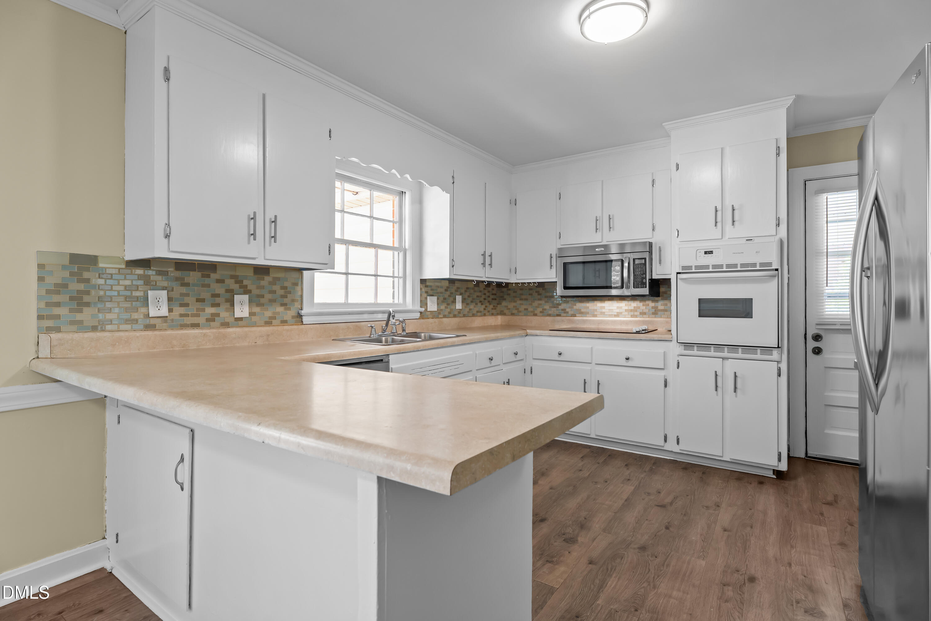 4149 Woodcrest Road Rocky Mount, NC 27803 - Photo 21 of 43 a kitchen with cabinets appliances a sink and a counter space