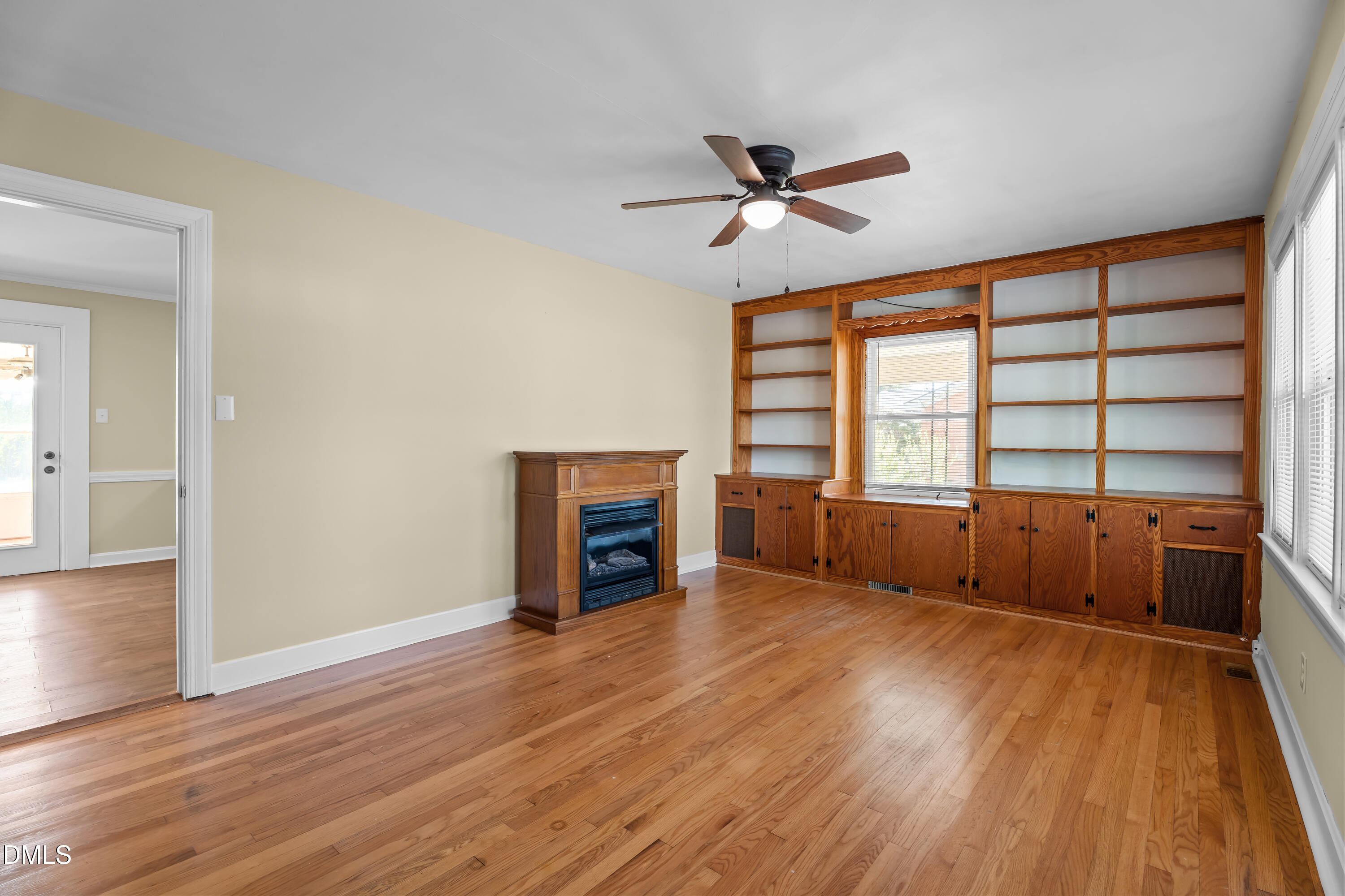 4149 Woodcrest Road Rocky Mount, NC 27803 - Photo 22 of 43 a view of an empty room with a window and wooden floor