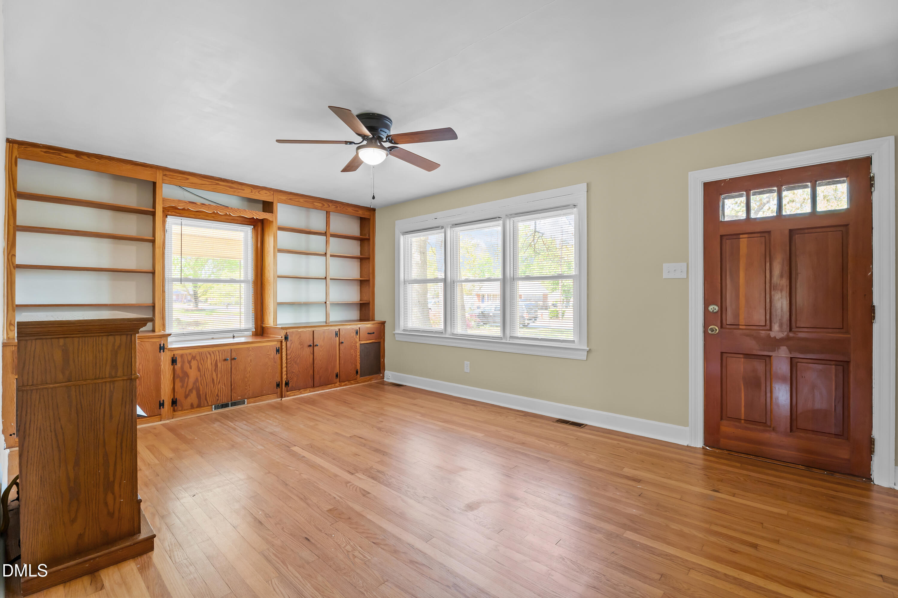 4149 Woodcrest Road Rocky Mount, NC 27803 - Photo 23 of 43 a view of an empty room with a window and wooden floor