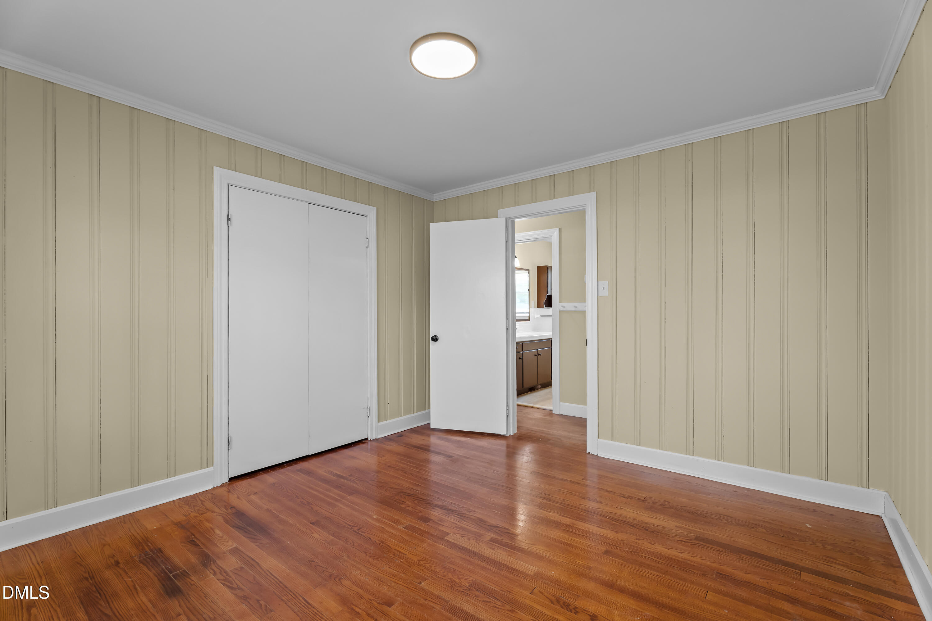 4149 Woodcrest Road Rocky Mount, NC 27803 - Photo 24 of 43 a view of an empty room with wooden floor and closet