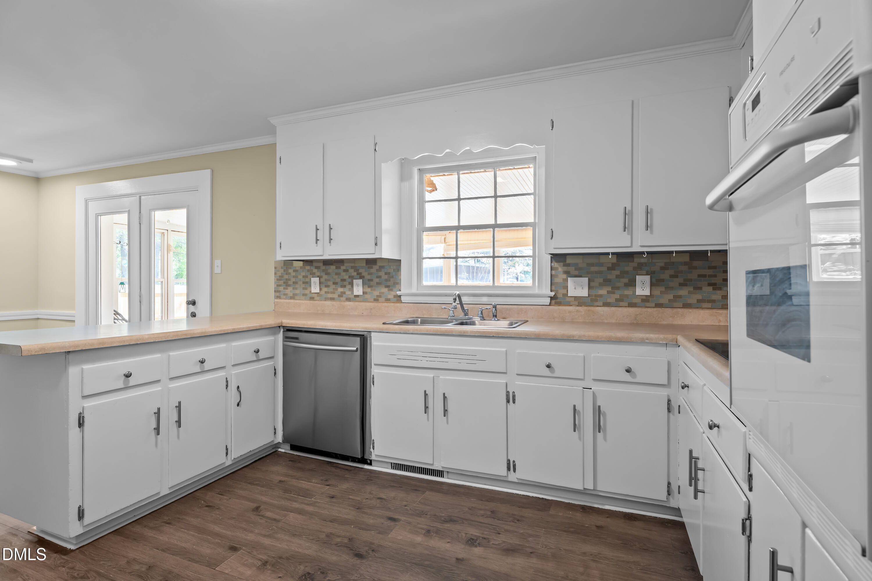 4149 Woodcrest Road Rocky Mount, NC 27803 - Photo 25 of 43 a kitchen with granite countertop white cabinets white appliances and sink