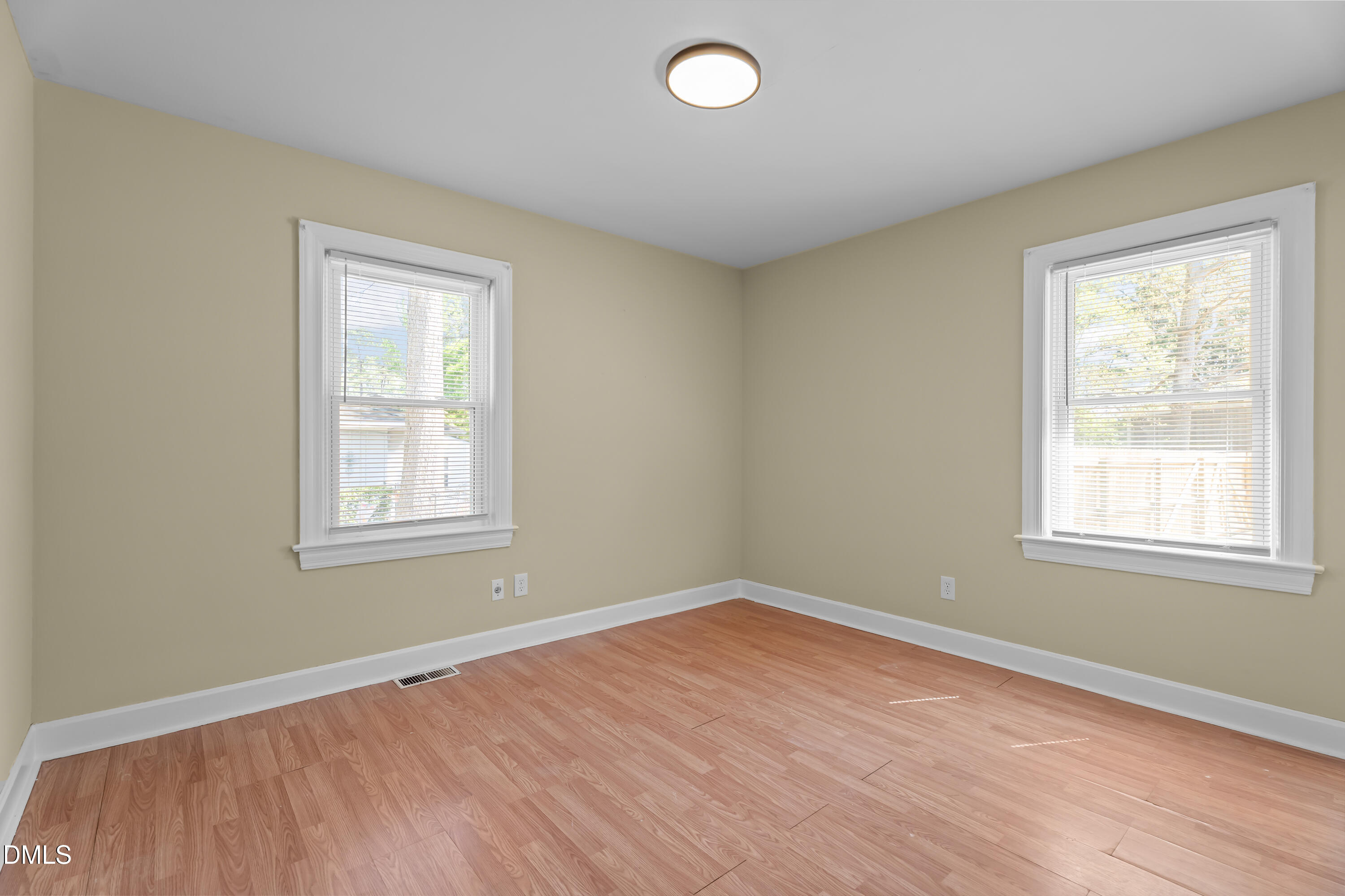 4149 Woodcrest Road Rocky Mount, NC 27803 - Photo 28 of 43 an empty room with wooden floor and windows