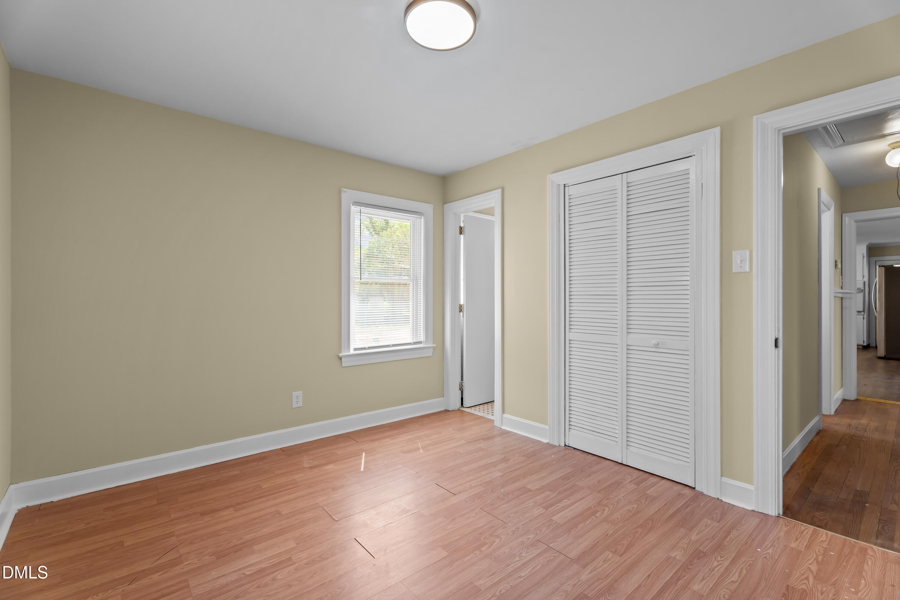 4149 Woodcrest Road Rocky Mount, NC 27803 - Photo 30 of 43 an empty room with wooden floor and windows