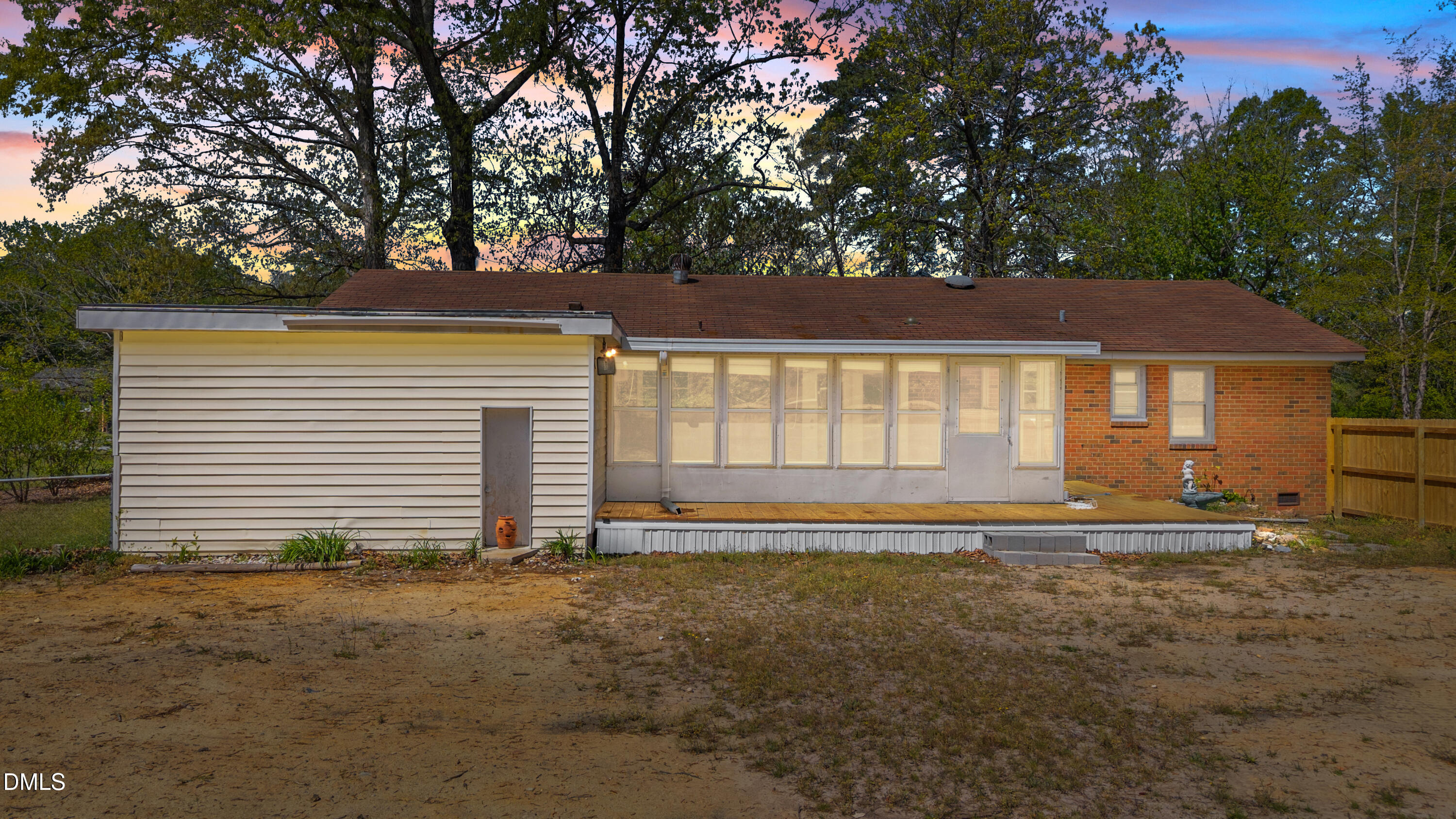 4149 Woodcrest Road Rocky Mount, NC 27803 - Photo 3 of 43 a house with trees in the background