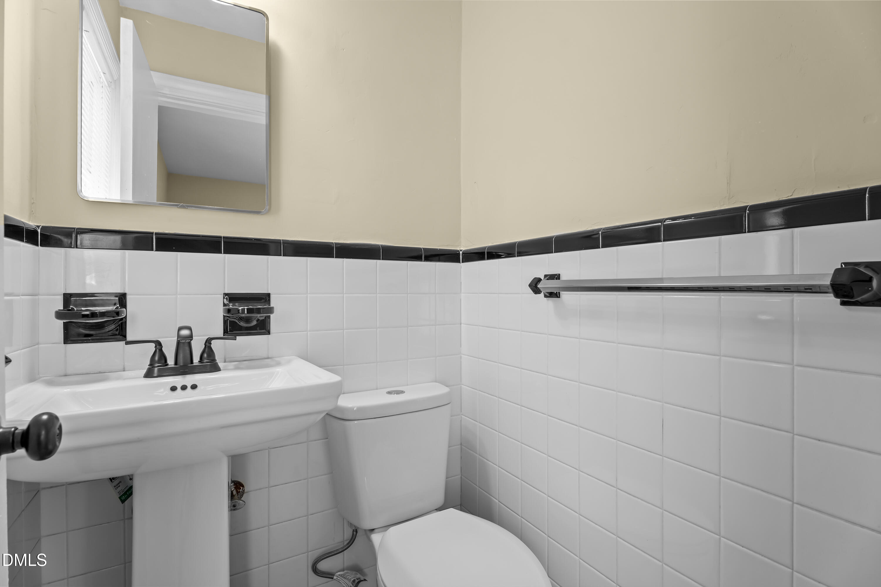 4149 Woodcrest Road Rocky Mount, NC 27803 - Photo 34 of 43 a bathroom with a sink mirror and toilet