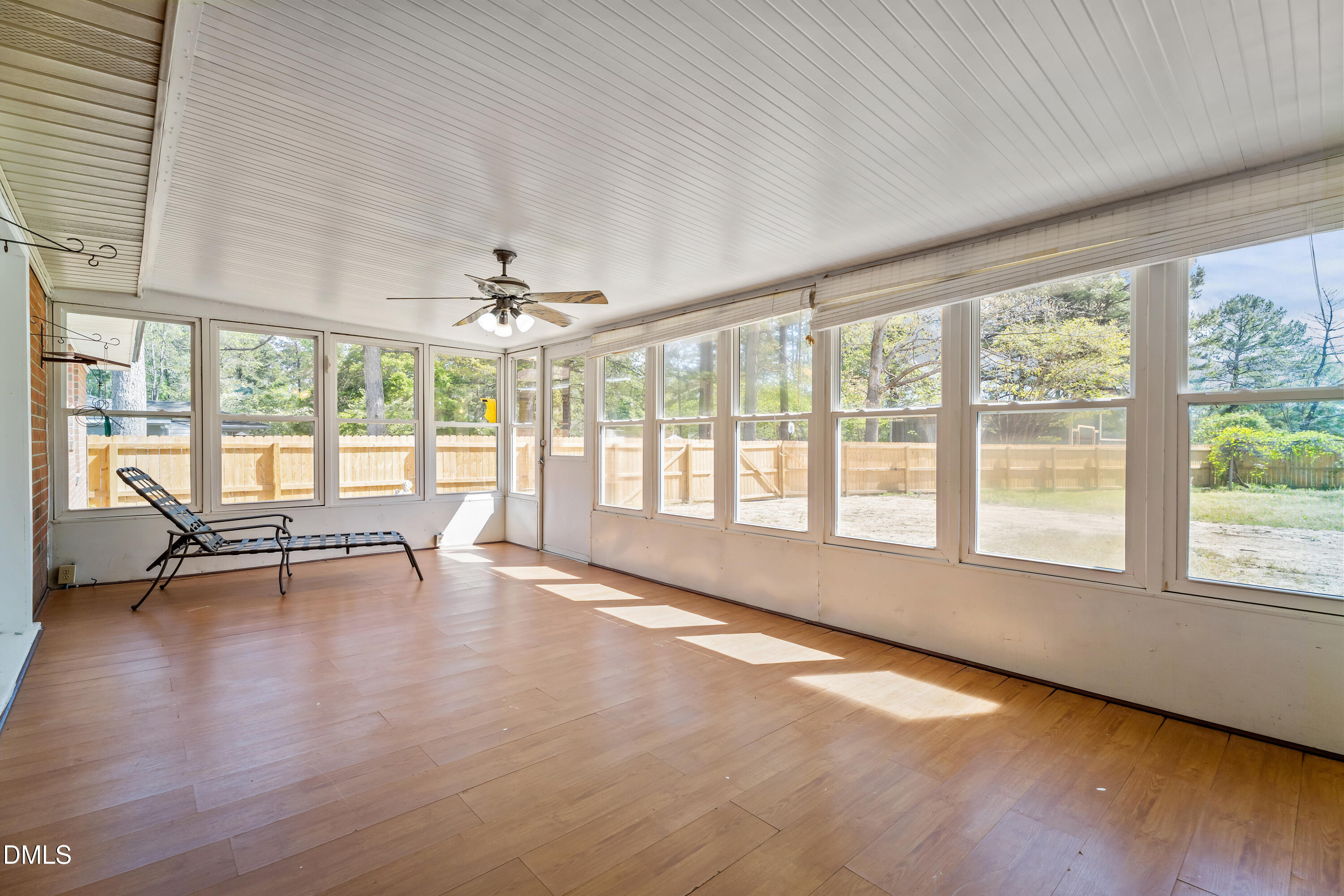 4149 Woodcrest Road Rocky Mount, NC 27803 - Photo 36 of 43 a view of an empty room with wooden floor and a window