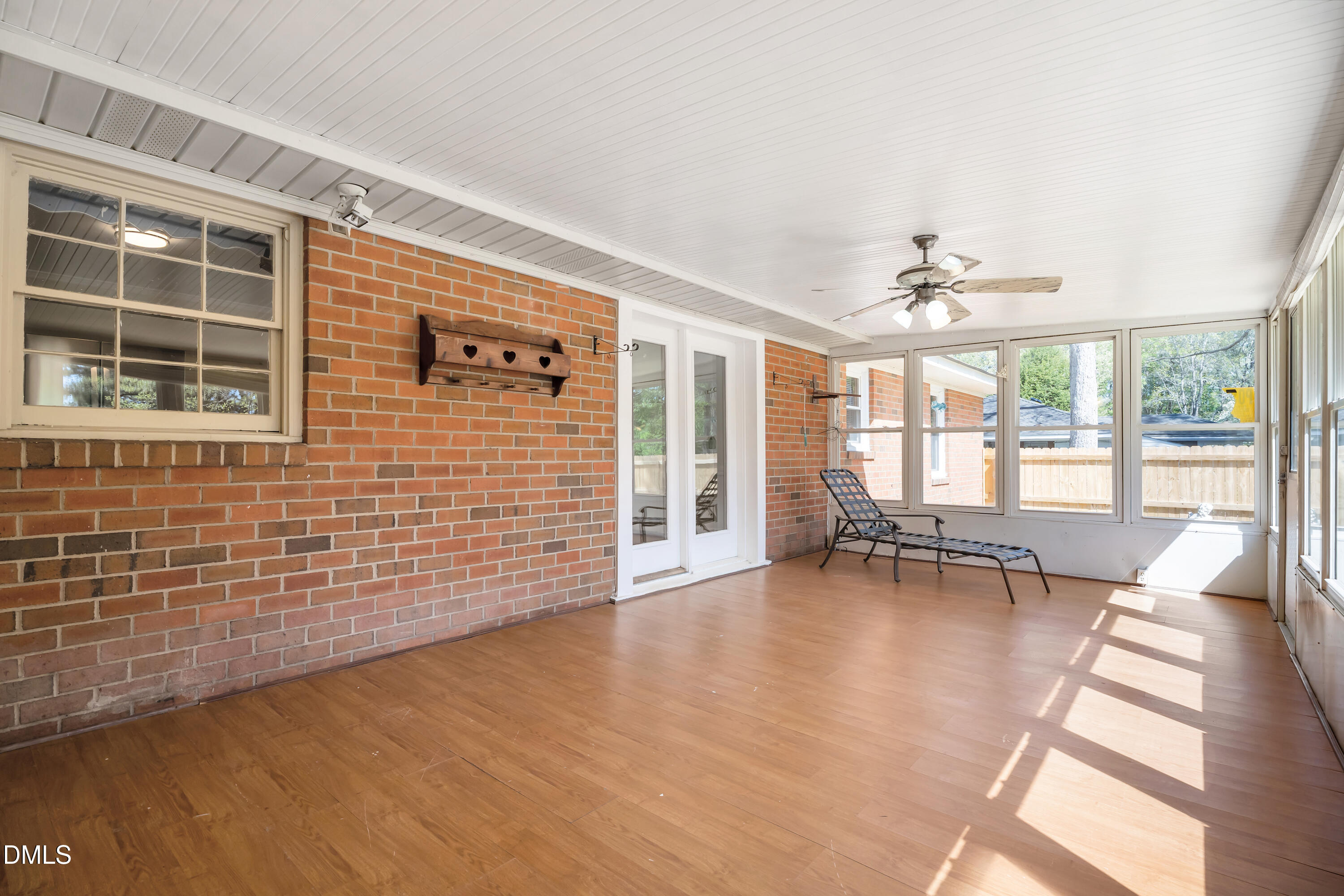 4149 Woodcrest Road Rocky Mount, NC 27803 - Photo 37 of 43 a view of an empty room with a window and wooden floor