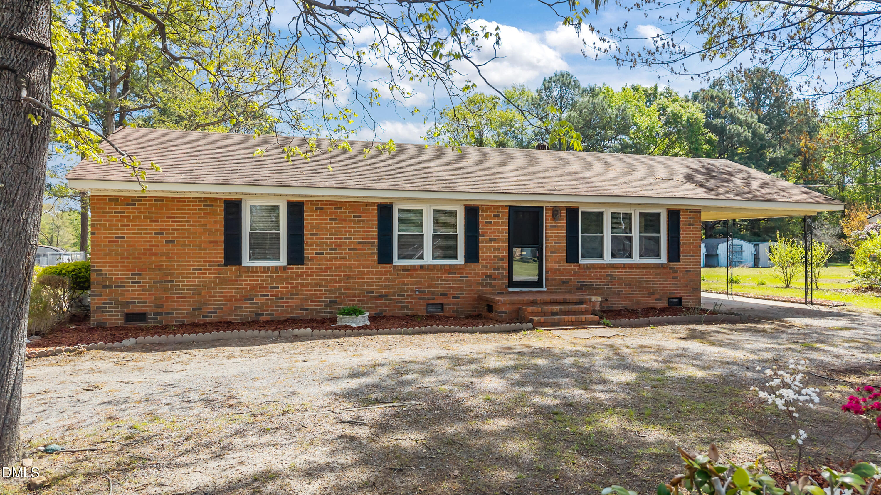 4149 Woodcrest Road Rocky Mount, NC 27803 - Photo 4 of 43 a house view with a outdoor space