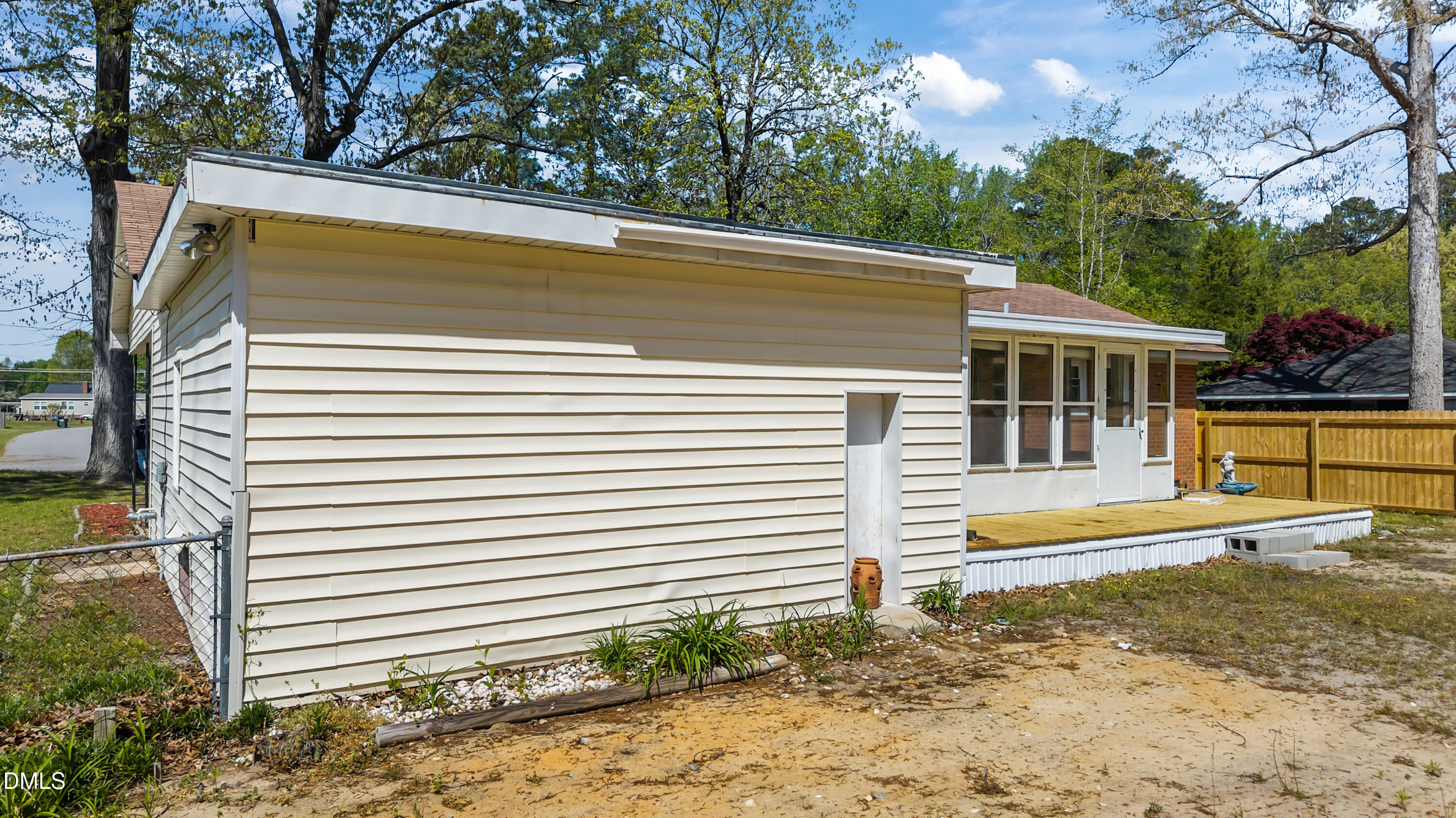4149 Woodcrest Road Rocky Mount, NC 27803 - Photo 7 of 43 a view of a house with a backyard and trees