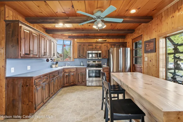 a view of a dining room with furniture and window