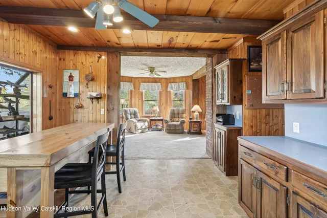 a dining room with furniture and window