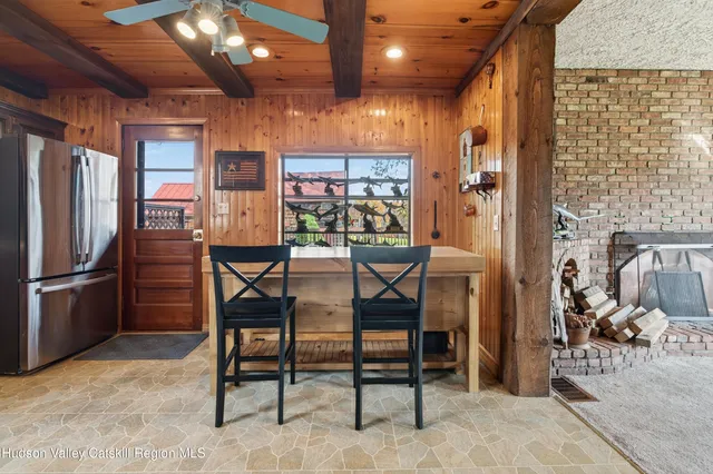 a bedroom with a bed a mirror and couch