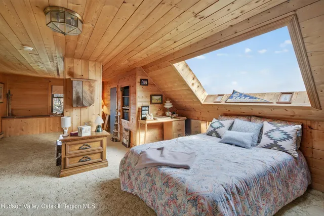 a bathroom with a granite countertop sink a bathtub and window
