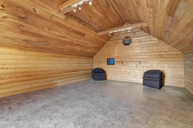 a view of balcony with wooden floor and fence
