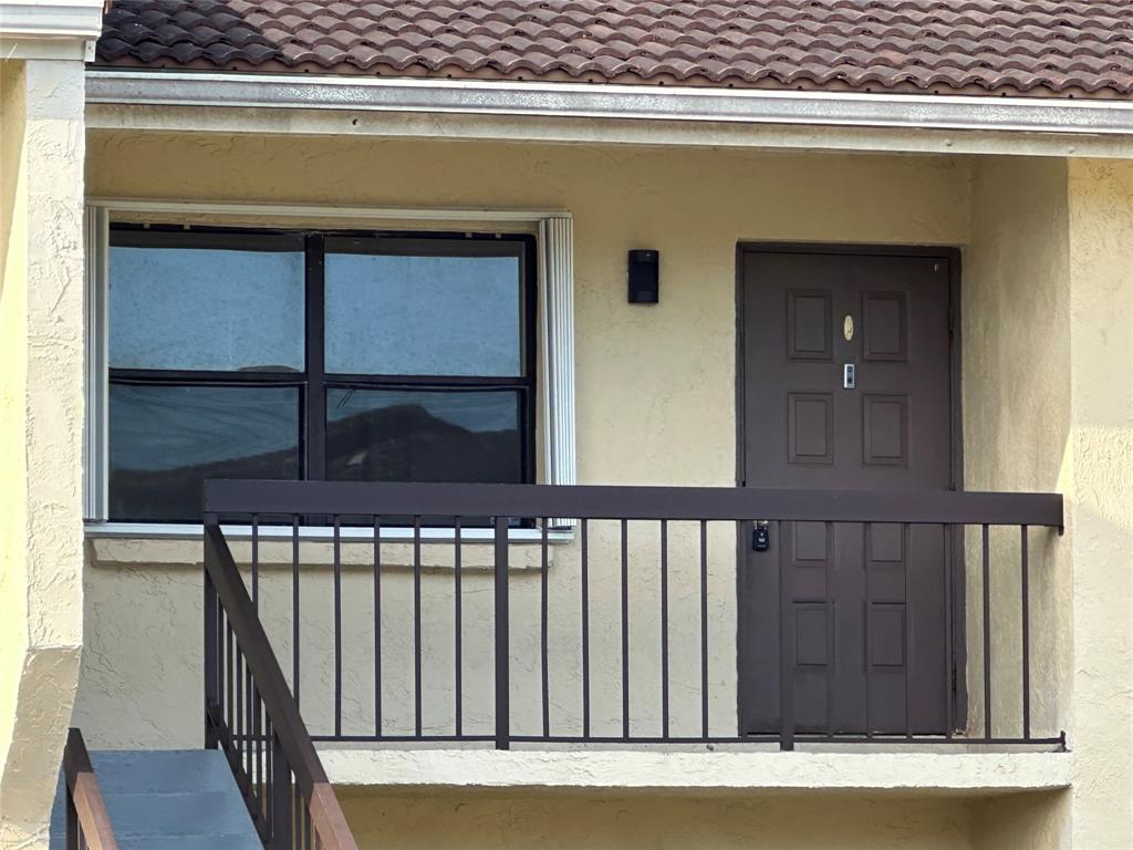 22415 Southwest 61st Way, Unit 202 Boca Raton, FL 33428 - Photo 10 of 14 a view of a wooden door