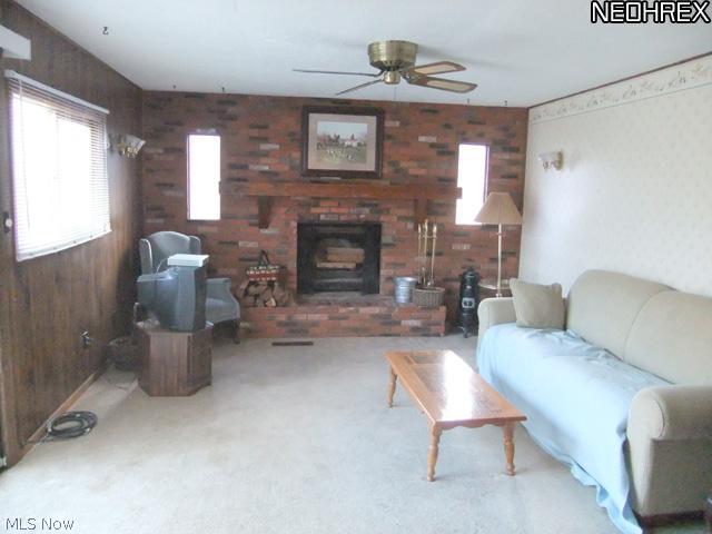 2107 South Hametown Road Akron, OH 44321 - Photo 5 of 18 The family room offers a neutral layout with a full wall brick fireplace.