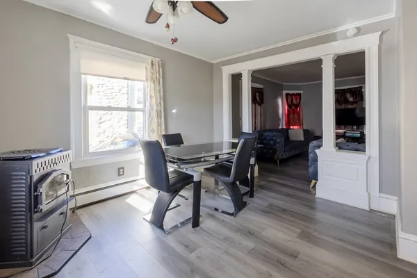 a view of a dining room with furniture window and wooden floor
