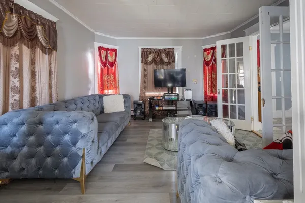 a living room with furniture and a large window