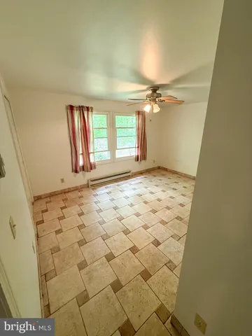 a view of an empty room and window