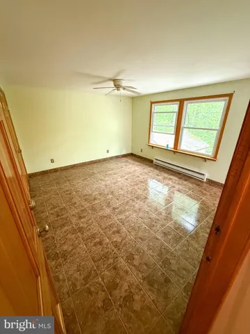 a view of an empty room and window