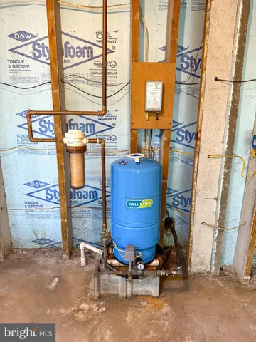 a room with multiple dryer and a window