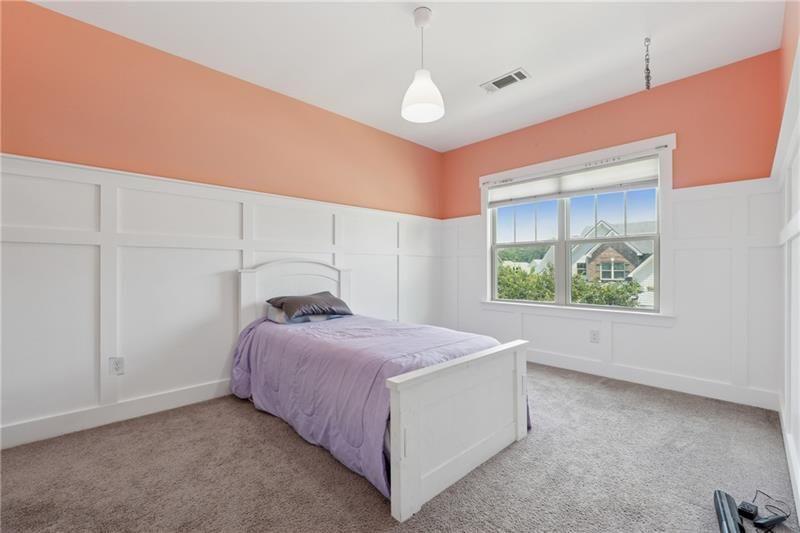 108 Madison Street Canton, GA 30115 - Photo 23 of 43 a bedroom with a bed and a window