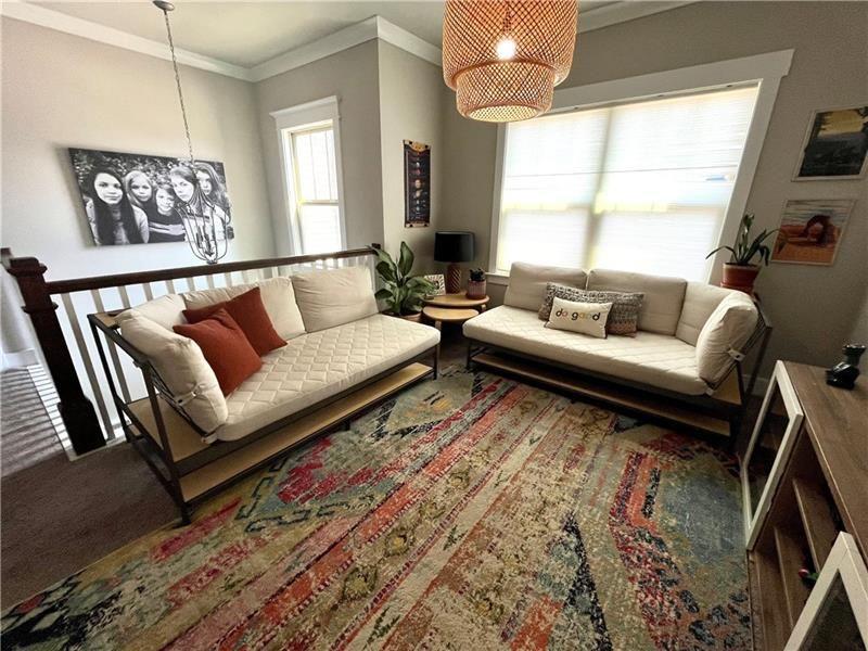 108 Madison Street Canton, GA 30115 - Photo 28 of 43 a living room with furniture and a large window