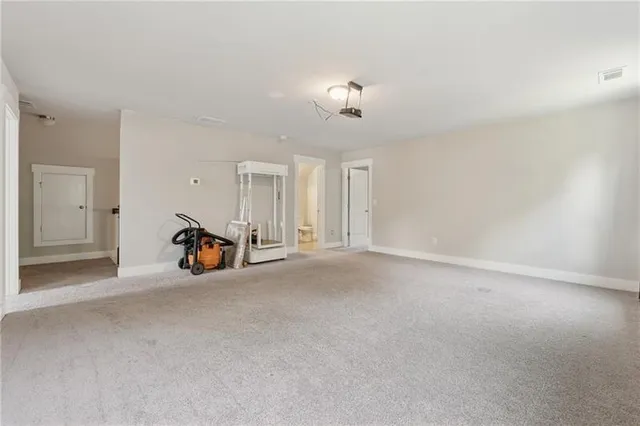 a living room with a fireplace and a garden