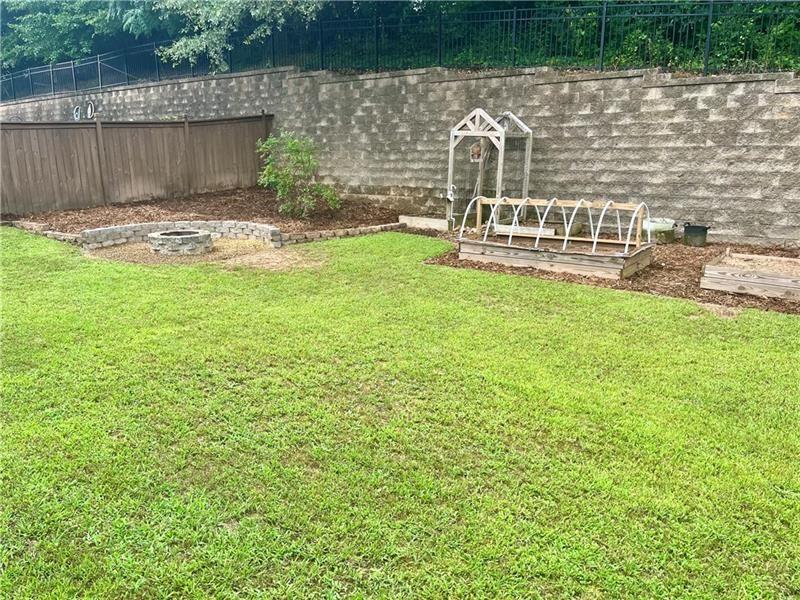 108 Madison Street Canton, GA 30115 - Photo 37 of 43 a backyard of a house with table and chairs