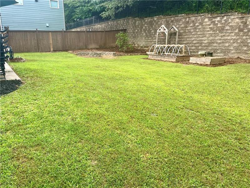 108 Madison Street Canton, GA 30115 - Photo 38 of 43 a view of a lake with a yard