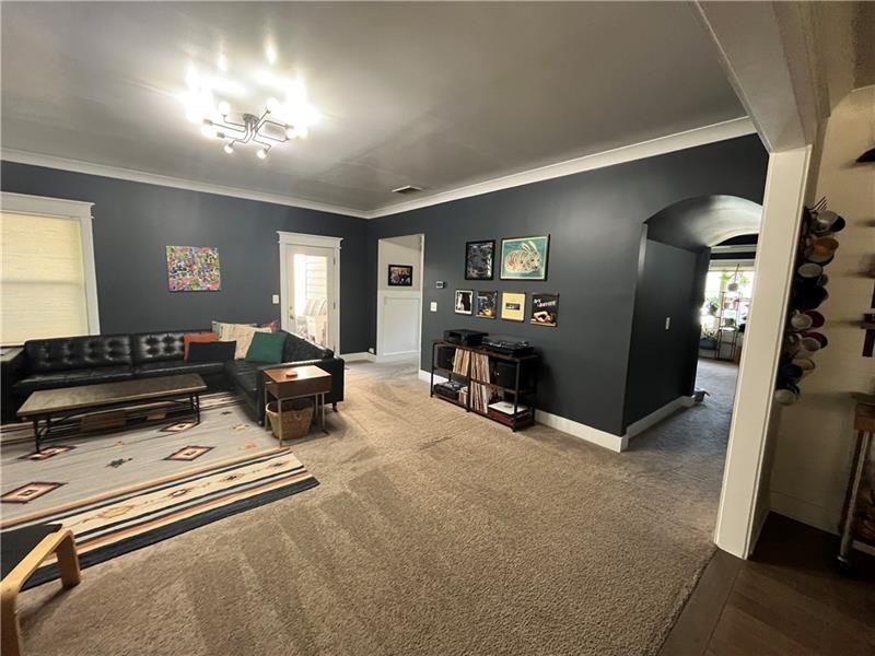 108 Madison Street Canton, GA 30115 - Photo 5 of 43 a living room with furniture and a flat screen tv