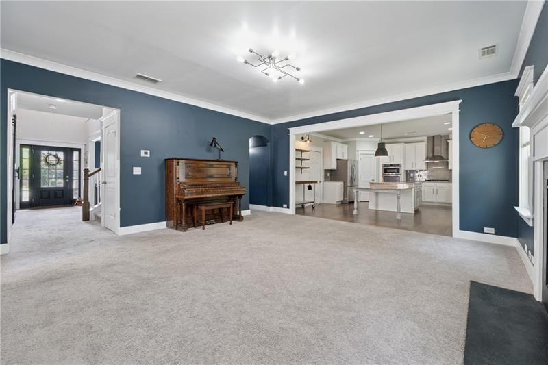 108 Madison Street Canton, GA 30115 - Photo 8 of 43 a living room with furniture and a flat screen tv