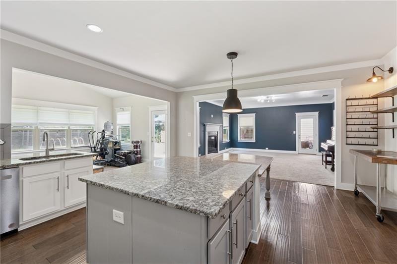 108 Madison Street Canton, GA 30115 - Photo 9 of 43 a kitchen with sink stove and center island