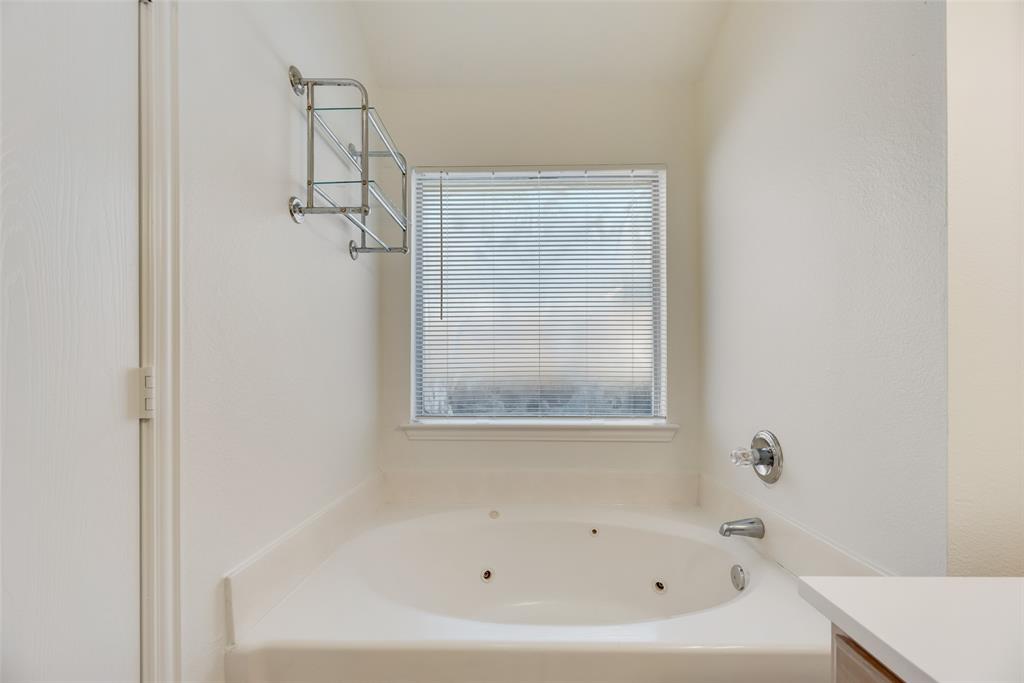 1048 Port Sullivan Drive Little Elm, TX 75068 - Photo 12 of 19 a white bath tub sitting next to a white sink
