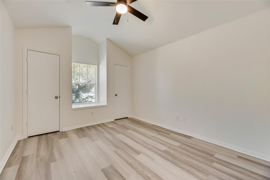 1048 Port Sullivan Drive Little Elm, TX 75068 - Photo 15 of 19 wooden floor in an empty room with a window