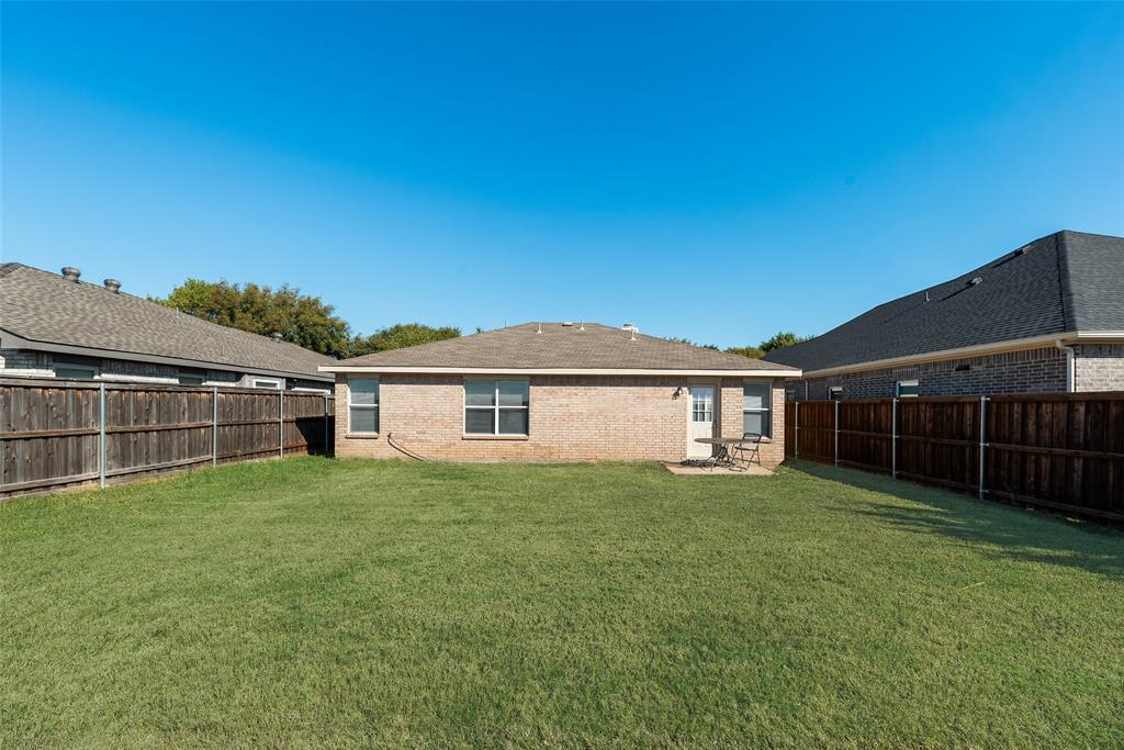 1048 Port Sullivan Drive Little Elm, TX 75068 - Photo 18 of 19 a view of a house with a yard