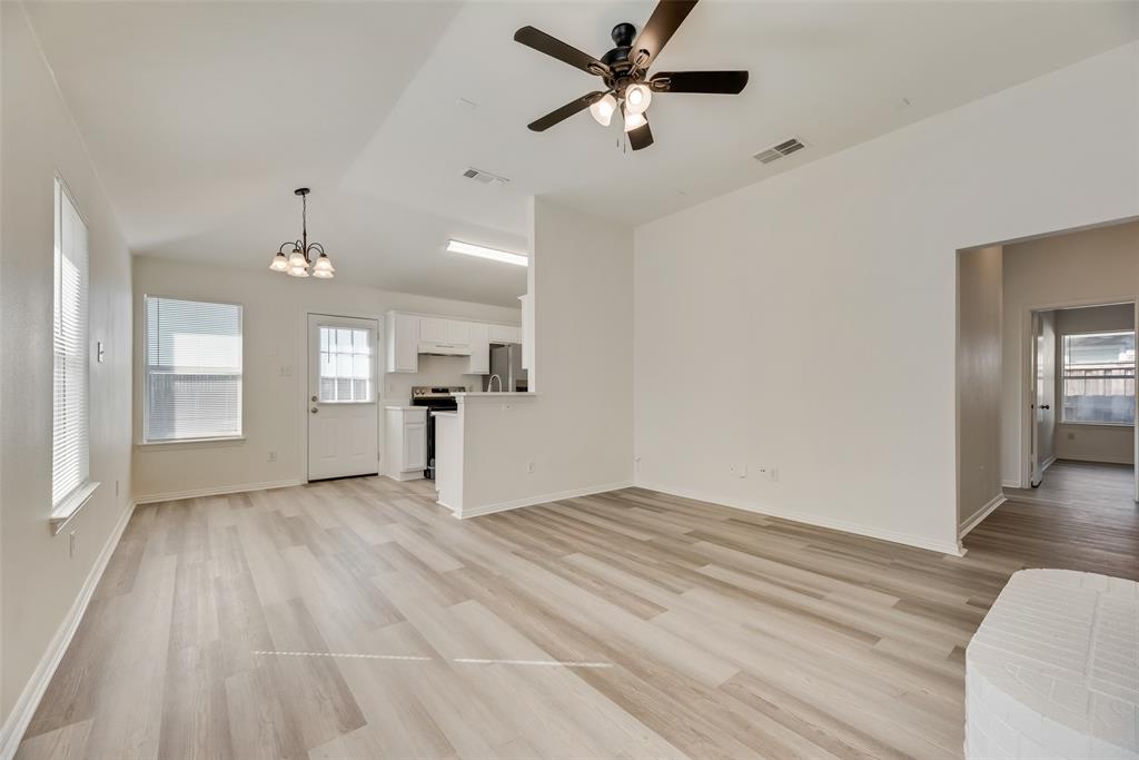 1048 Port Sullivan Drive Little Elm, TX 75068 - Photo 4 of 19 wooden floor in an empty room with a window