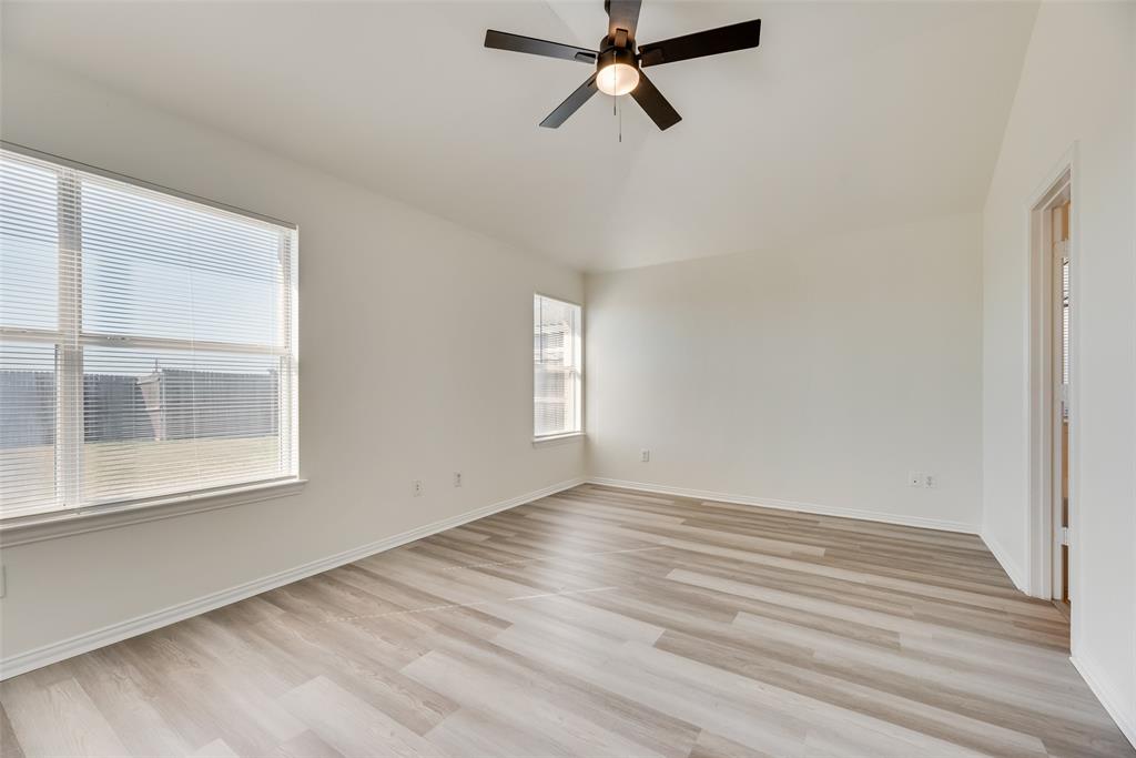 1048 Port Sullivan Drive Little Elm, TX 75068 - Photo 9 of 19 a view of a room with wooden floor and windows