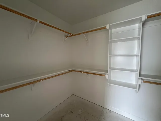 a view of an empty walk in closet