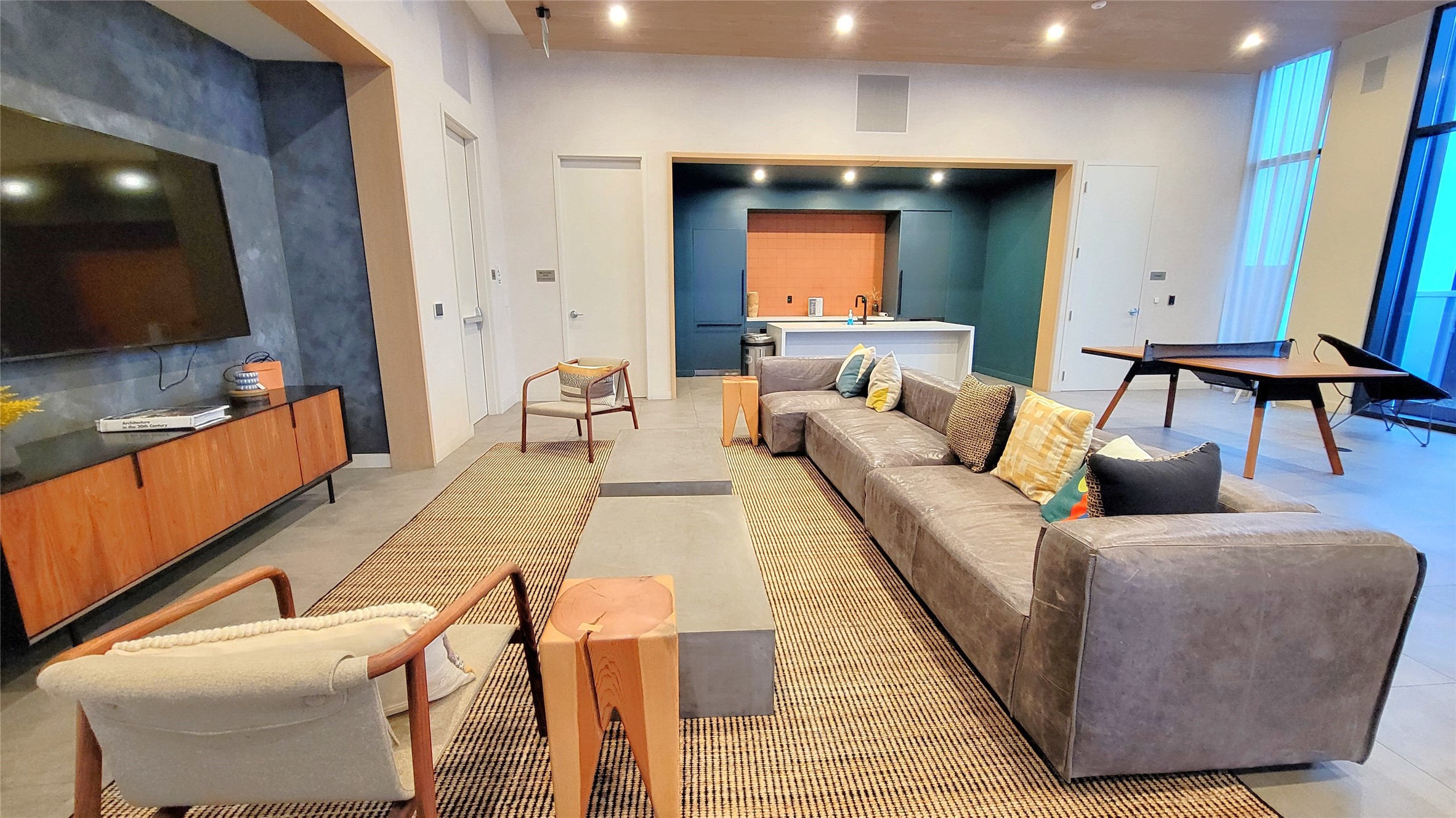 48 East Avenue, Unit 2206 Austin, TX 78701 - Photo 21 of 24 a living room with furniture and a flat screen tv