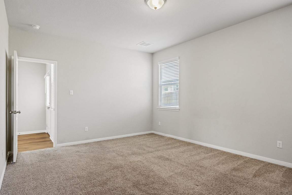 110 Lullaby Drive Georgetown, TX 78626 - Photo 16 of 39 an empty room with windows