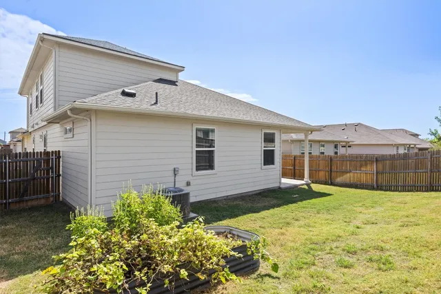 a view of a backyard of the house
