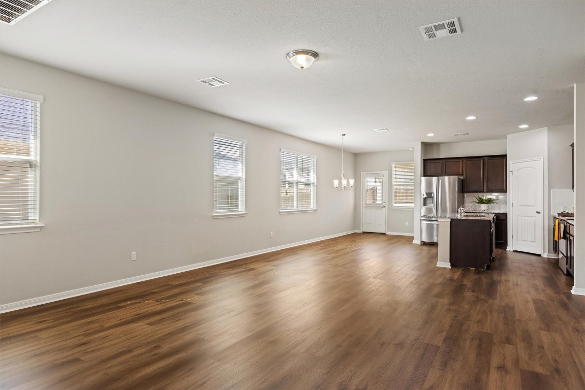 110 Lullaby Drive Georgetown, TX 78626 - Photo 7 of 39 a view of kitchen with stainless steel appliances refrigerator microwave and stove