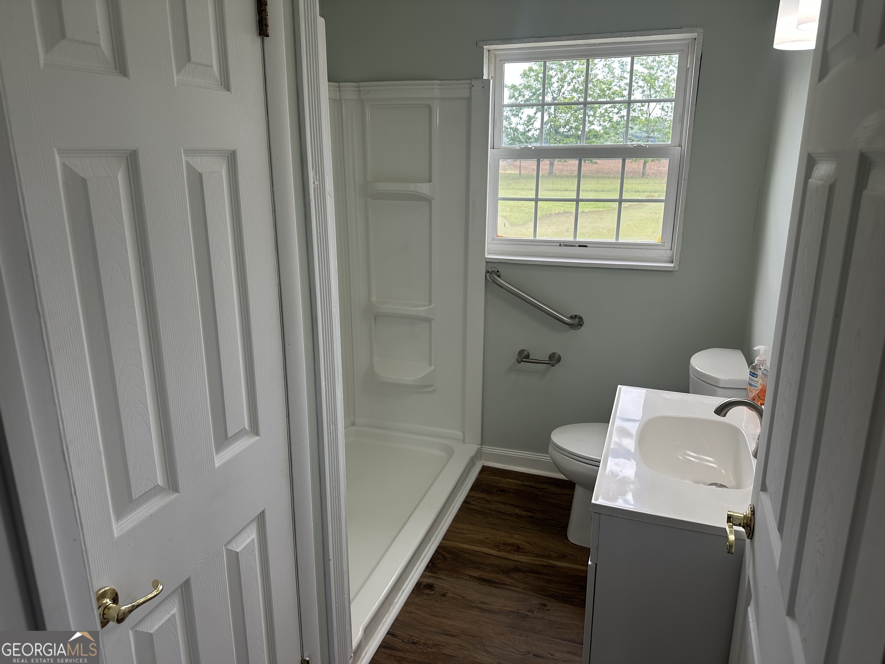 509 Whitehill Road Sylvania, GA 30467 - Photo 11 of 14 a bathroom with a toilet and a shower