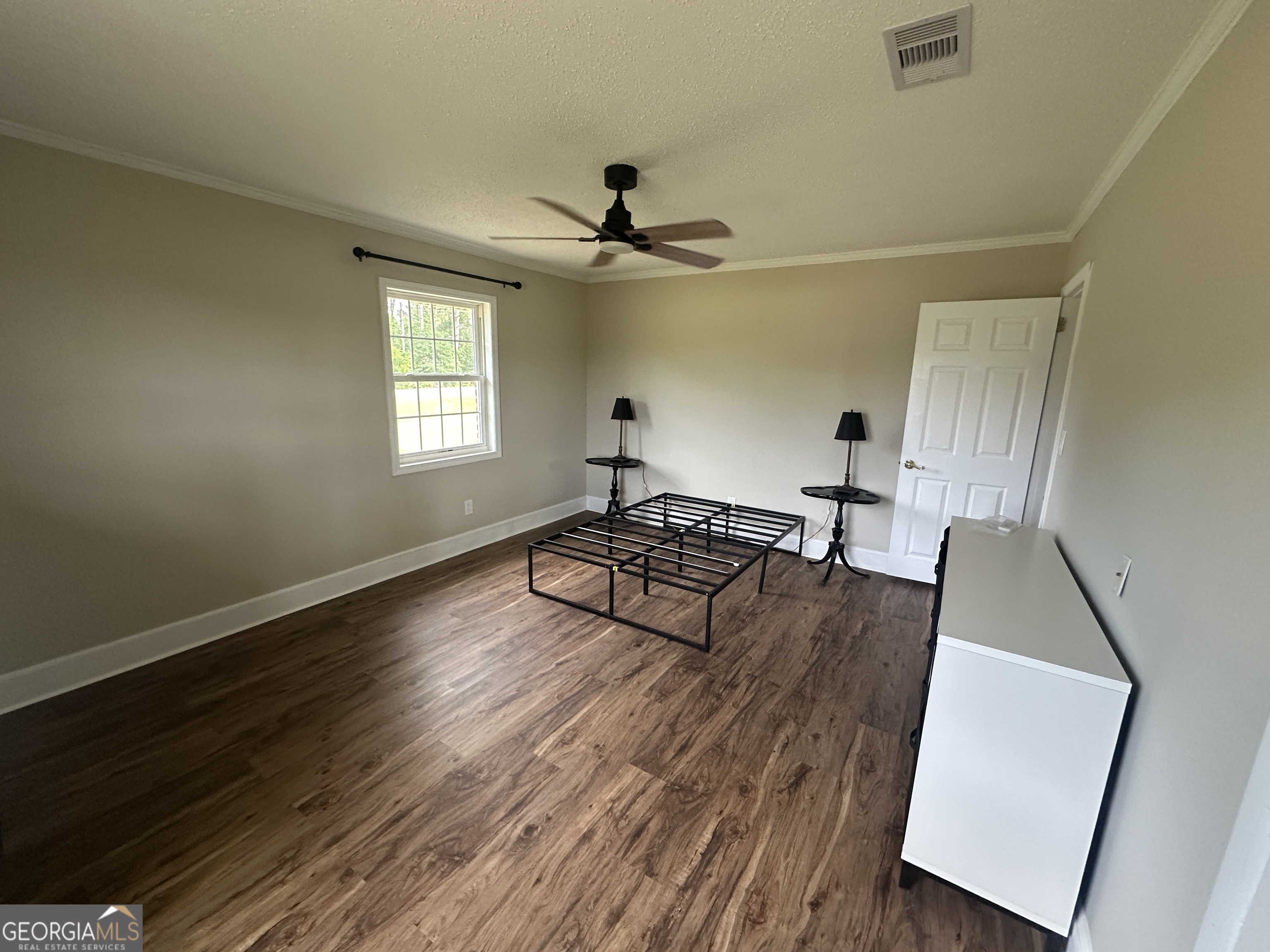 509 Whitehill Road Sylvania, GA 30467 - Photo 13 of 14 a living room with furniture and a wooden floor