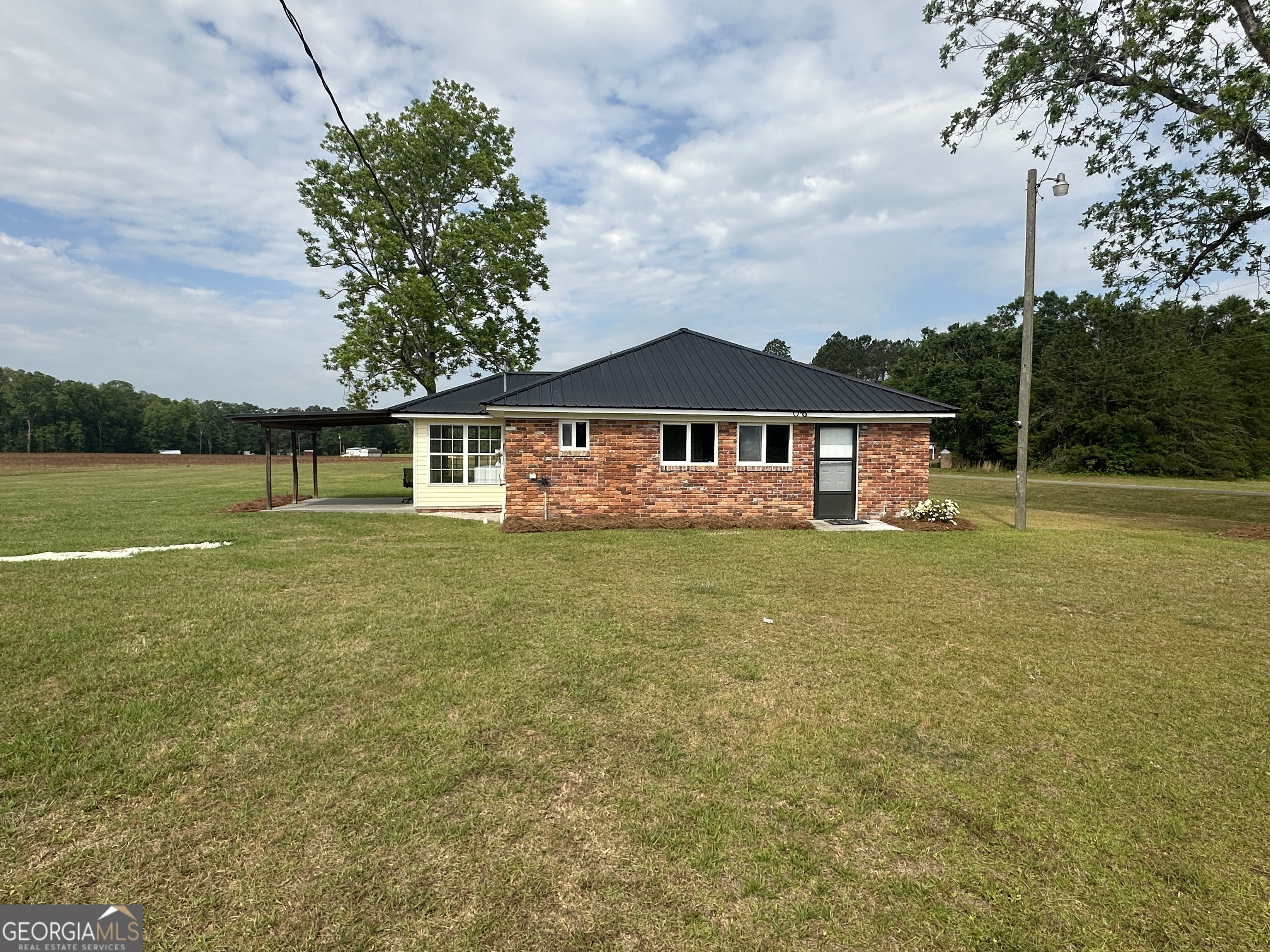 509 Whitehill Road Sylvania, GA 30467 - Photo 4 of 14 a house with swimming pool in front of it