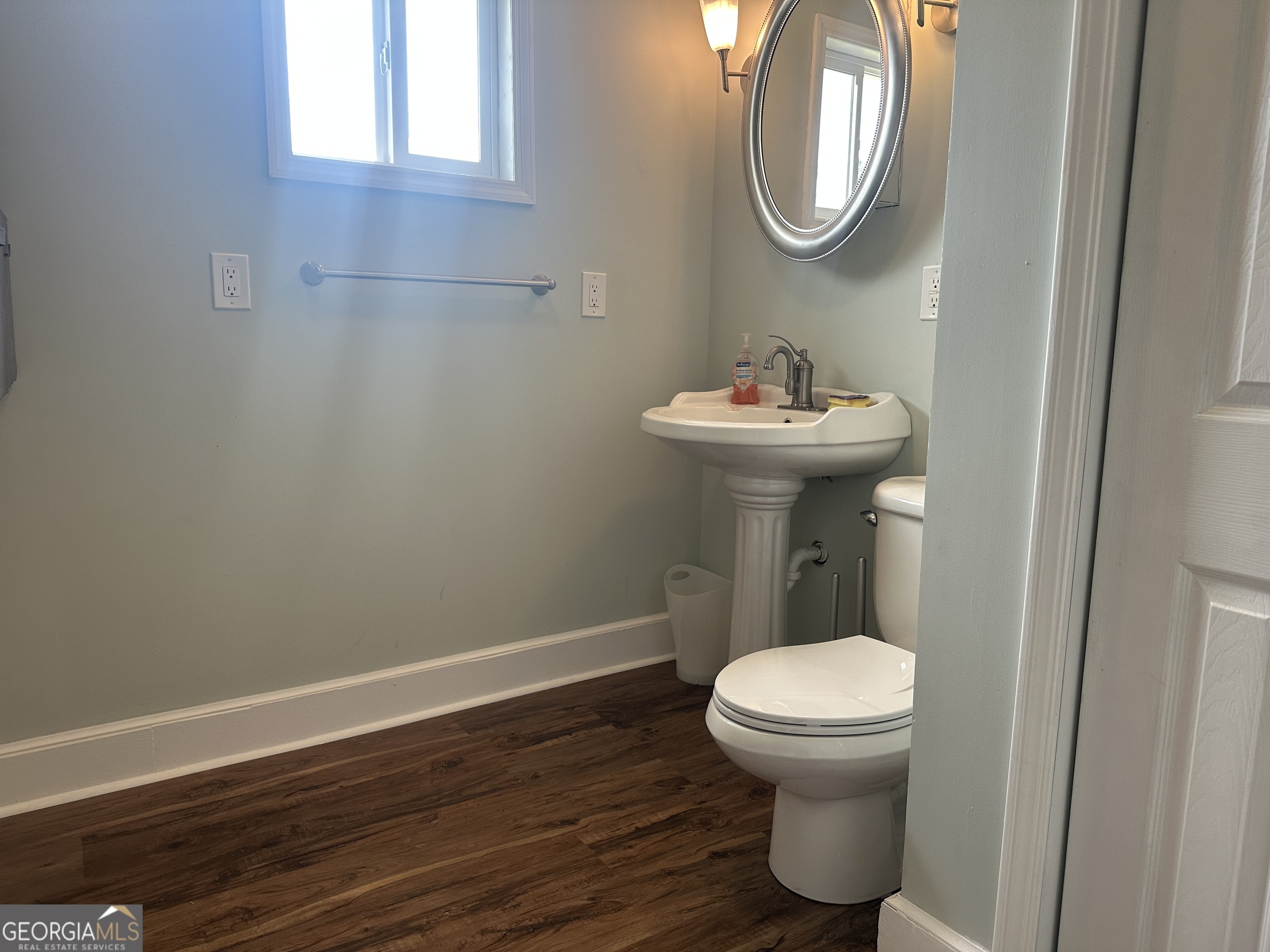 509 Whitehill Road Sylvania, GA 30467 - Photo 6 of 14 a bathroom with a toilet a sink and mirror