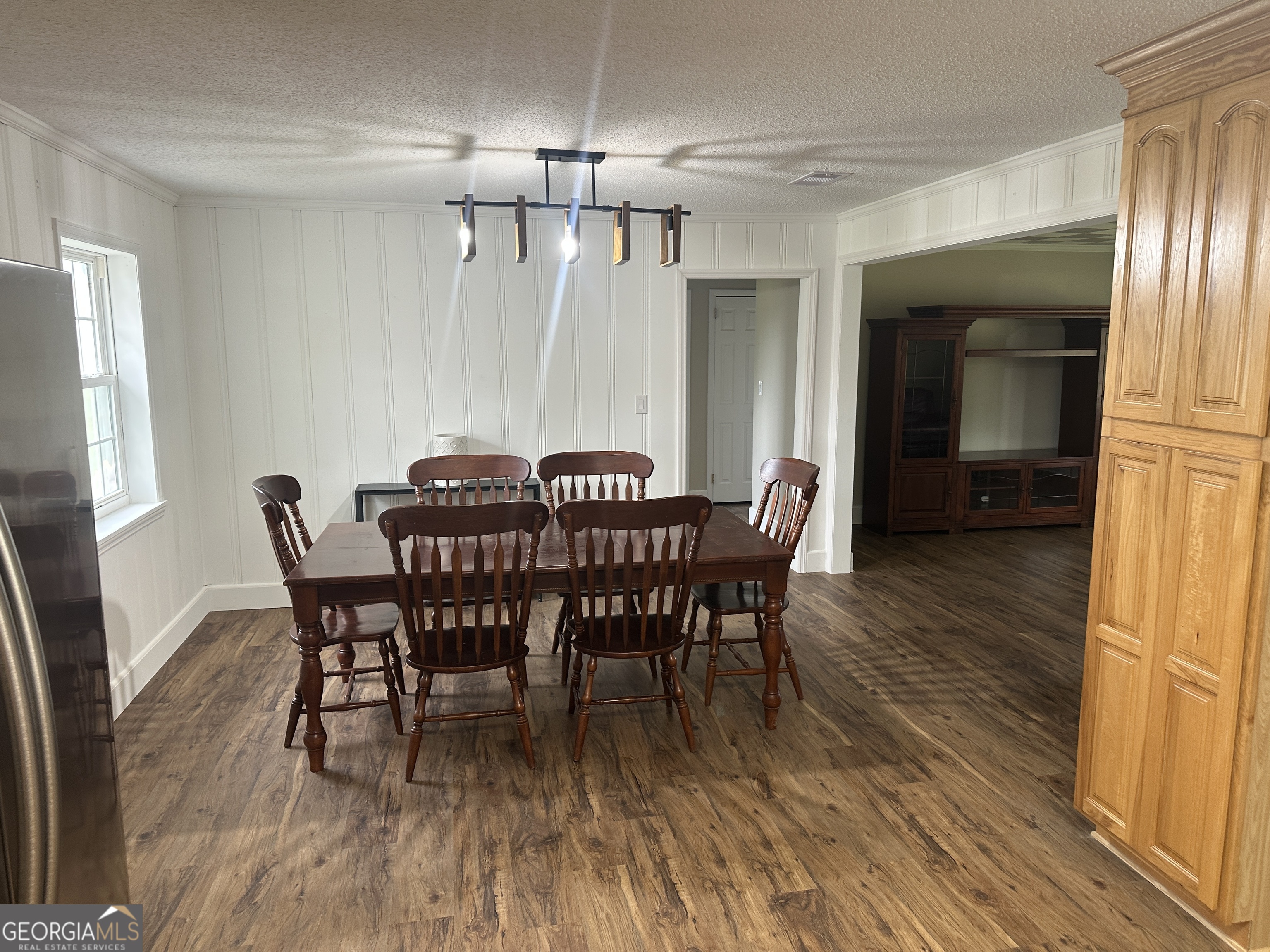509 Whitehill Road Sylvania, GA 30467 - Photo 9 of 14 a view of a dining room with furniture and wooden floor