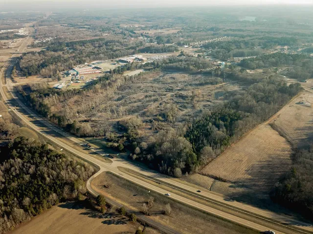 an aerial view of residential house with parking space